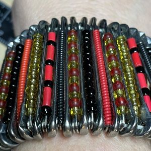 Seed beaded large safety pin style bracelet. Fits nicely on a larger wrist.